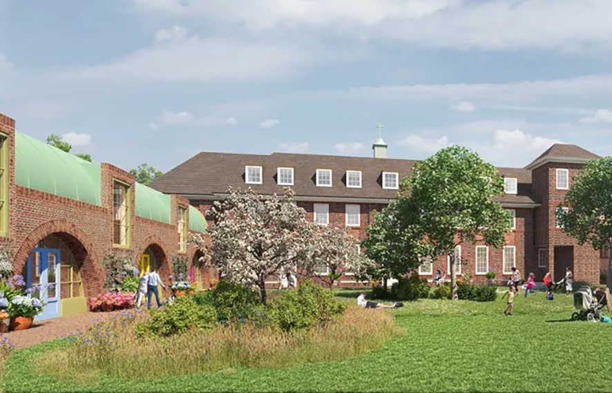 People sitting and playing in a grassy area surrounding by buildings on a sunny day.