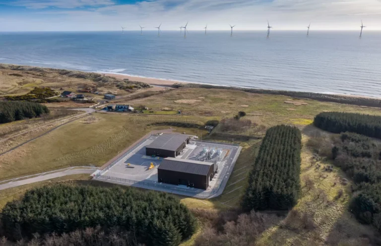 An aerial view of the Dogger Bank Wind Farm surrounded by fields.