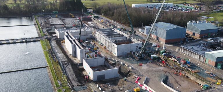 An aerial view of the Oswestry Water Treatment Works under construction in the daytime.