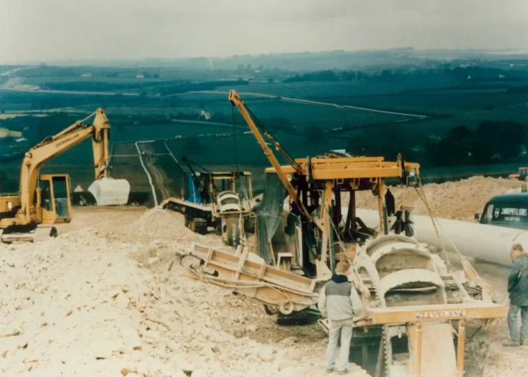 A gas construction site in the 1980s with fields in the background.