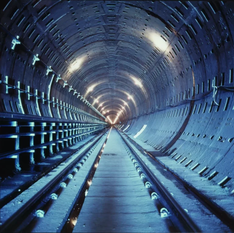 A large illuminated train tunnel.