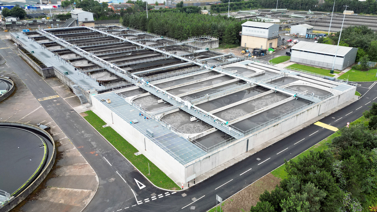 A wastewater treatment works from above in the daytime.