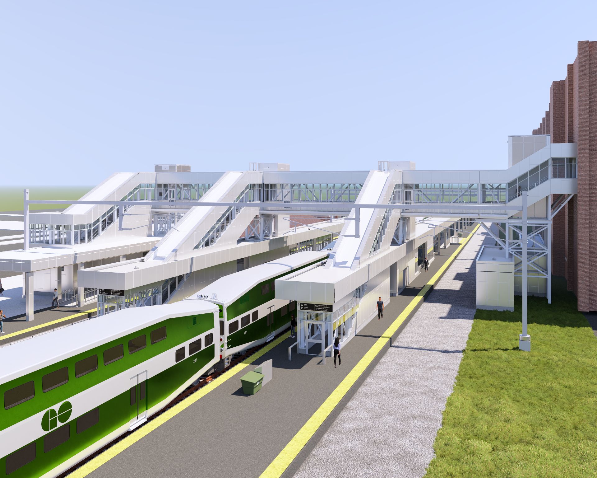 A rendering of railway station with a green train at a platform and enclosed bridge connecting the platforms and the station building